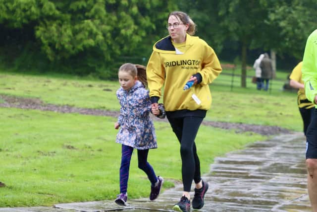 Mim Ireland battles through the bad weather.