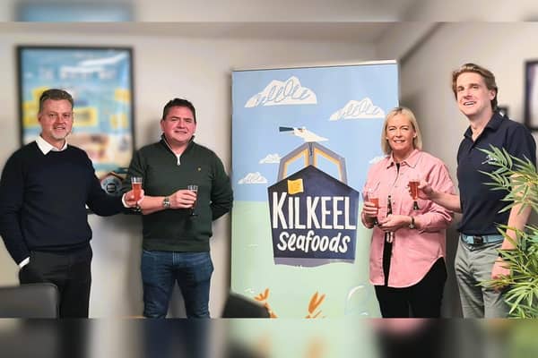 From left: Simon Cummings (Kilkeel MD), skipper Darren McClements, Judith McClements and Managing Director of Whitby Seafoods Daniel Whittle.