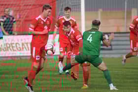Matty Dixon clears the ball in the 1-0 home win against Brighouse Town in the NPL Division East  PHOTOS BY DOM TAYLOR