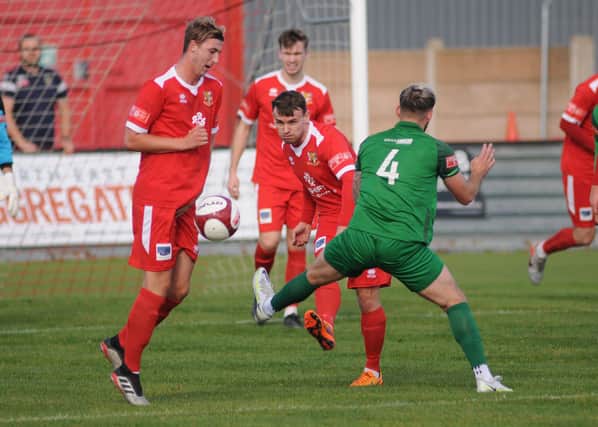Matty Dixon clears the ball in the 1-0 home win against Brighouse Town in the NPL Division East  PHOTOS BY DOM TAYLOR