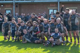 Scarborough RUFC players celebrate their win against Dronfield to beat relegation on the final day of the season.
