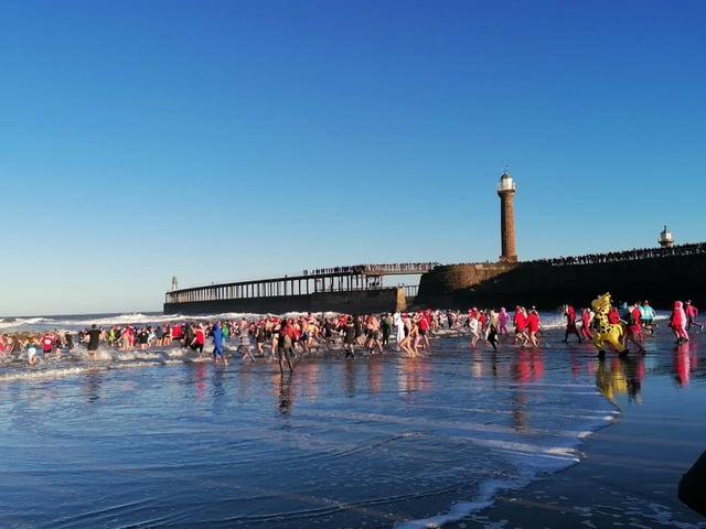 Great image of the Boxing Day dippers getting ready to take the plunge into the sea.
