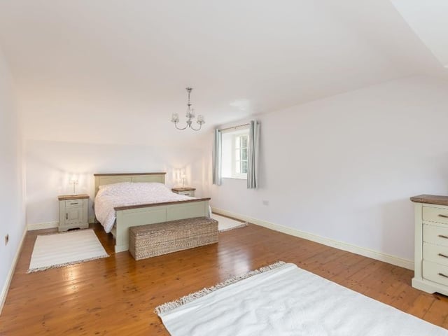 A very spacious double bedroom within the property.