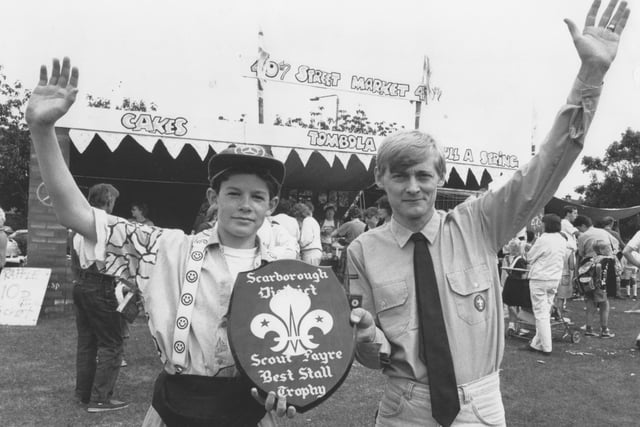 40th Scarborough Scout group leader Len Foster, right, is pictured with Scout Mark Williamson with the Scout Trophy for best stall in July, 1990. 
