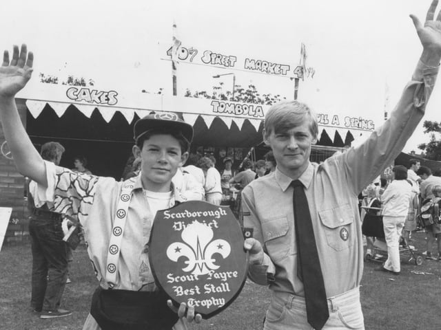40th Scarborough Scout group leader Len Foster, right, is pictured with Scout Mark Williamson with the Scout Trophy for best stall in July, 1990. 