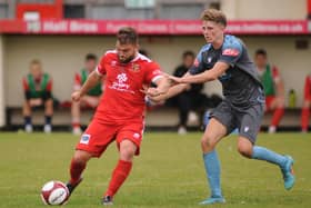 Andy Norfolk scored Bridlington Town's opening goal from the penalty spot in their last-gasp 3-2 loss at Tadcaster Albion on Easter Monday.