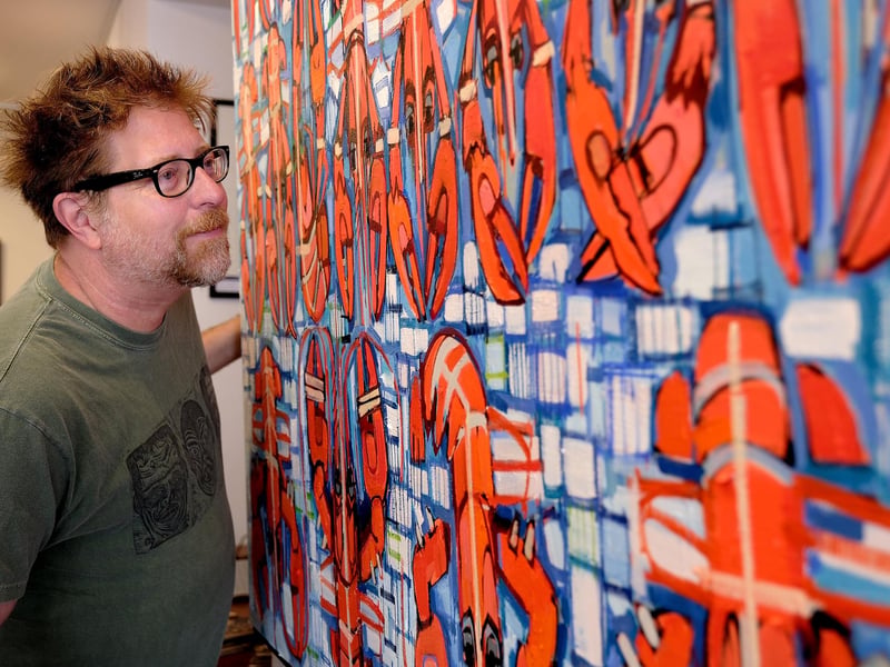 Sean views one of the artworks on display.
picture: Richard Ponter