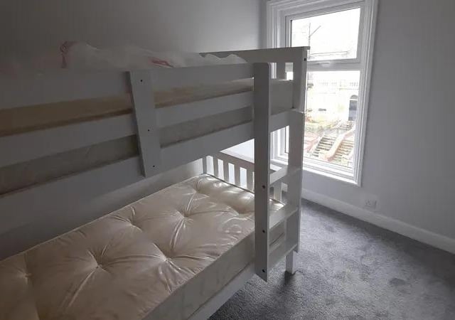 The third bedroom is a larger size single.
