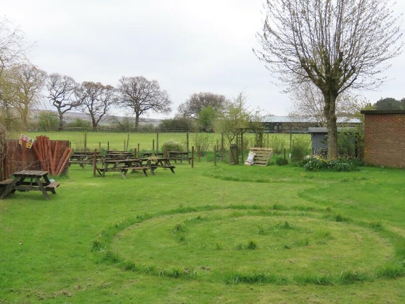 A scenic pub garden is an added attraction.