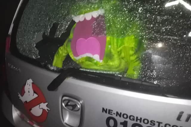 The car's smashed windscreen.