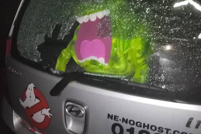 The car's smashed windscreen.