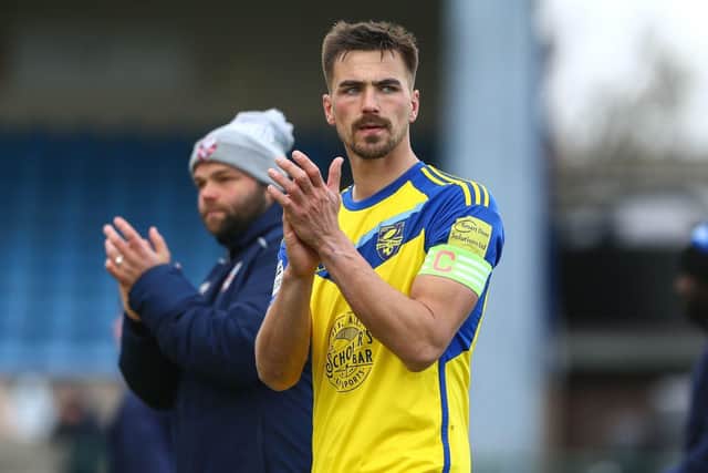 Boro skipper Will Thornton thanks the travelling fans after the 2-0 loss at Buxton. Photo by Zach Forster