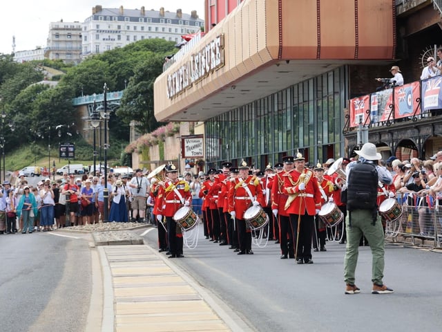 The oncoming parade was so striking in their red uniforms.