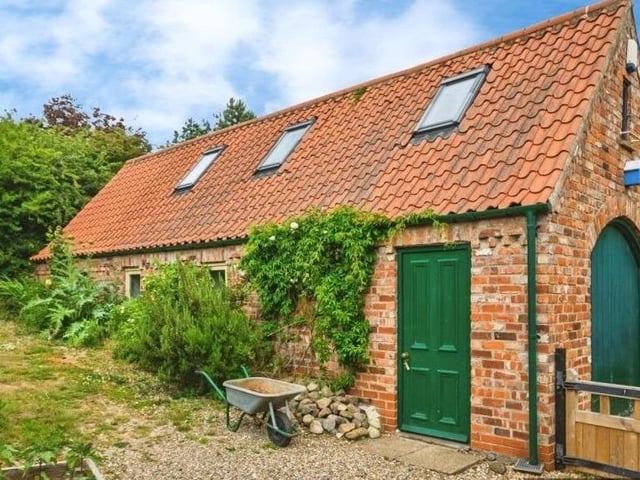 The sizeable outbuilding that could suit multiple purposes.
