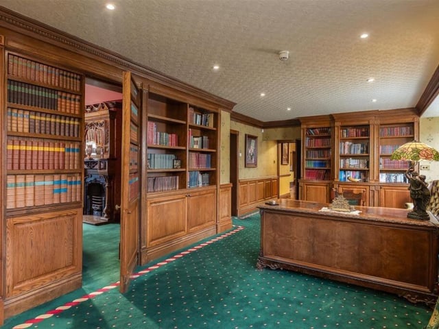 The library, with fitted shelving.