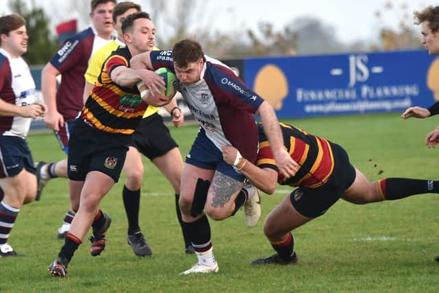 James Long tries to shake off some Bradford & Bingley players.