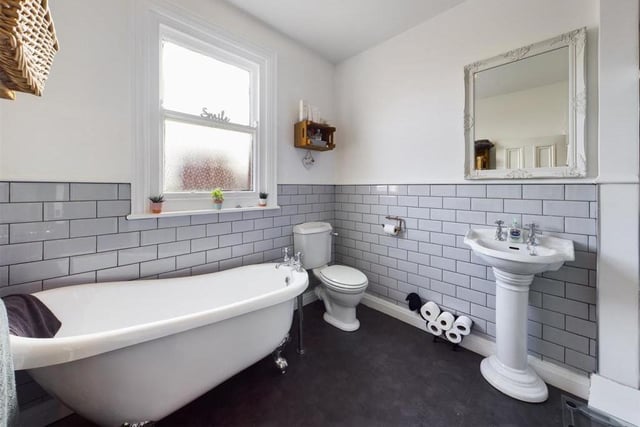 The bathroom on the first floor includes a free standing bath tub within its suite.