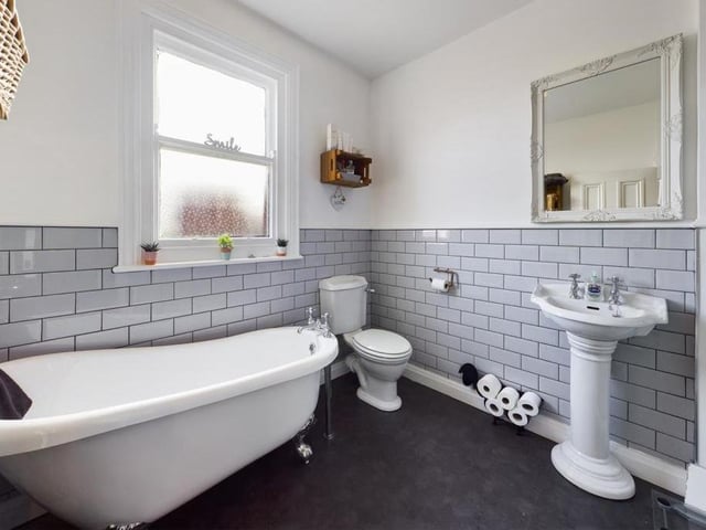 The bathroom on the first floor includes a free standing bath tub within its suite.