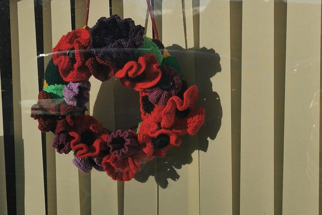 Poppy wreath made by Sandra Young of Sleights, on display in the window of Ingham Close Community Centre in Sleights.
