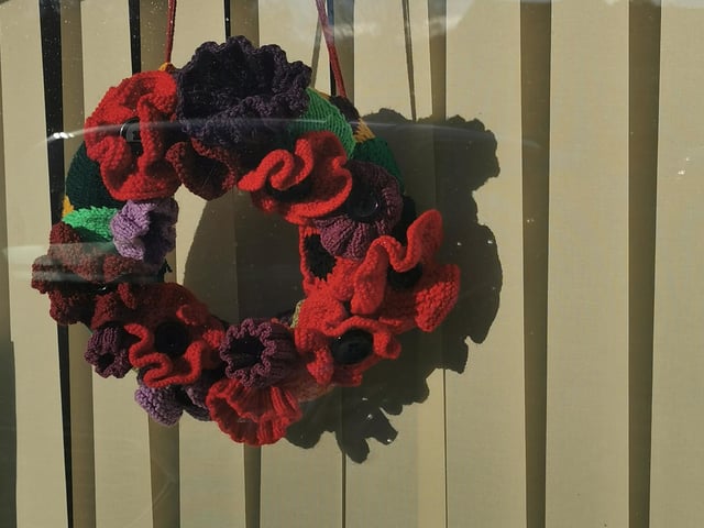 Poppy wreath made by Sandra Young of Sleights, on display in the window of Ingham Close Community Centre in Sleights.