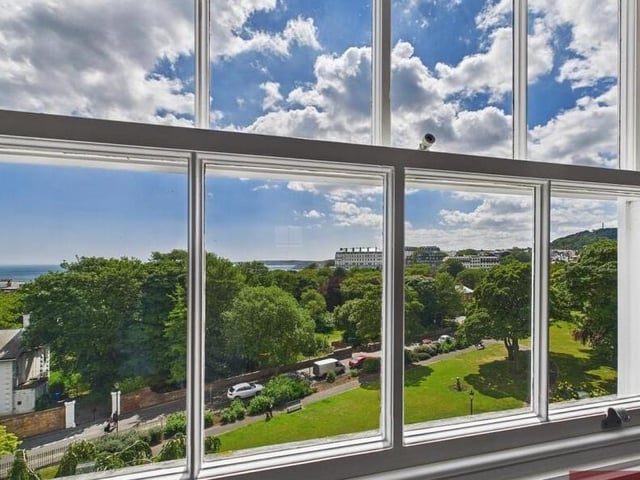 Many windows have stunning coastline views, as does this one in the kitchen.