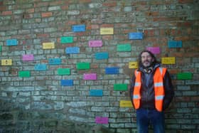 Artist Adrian Lewis with the public art by Scarborough cliff lift. picture: Yolanda Carslaw/Scarborough Spy.
