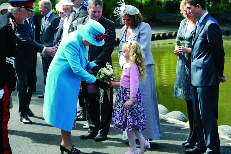 Queen opens the Open Air Theatre - The Queen is presented with a bouquet by six-year-old Sophie Bellringer, from Hull, who was chosen from a draw of Yorkshire Water employees families, to present a posy to the Queen, on her arrival.
102086c