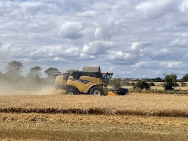 Chris Fisher captured this image of a combine harvester in a field at Cayton.