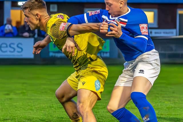 Haswell gets to grips with a Bamber Bridge player.