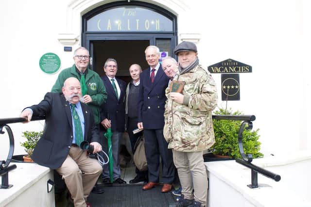 Commando veterans are pictured with the green plaque. Photo taken by Ian Ellis