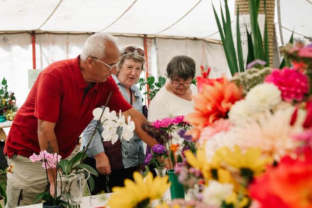 Farndale Show president Beryl Smith with show chair Muriel Tinsley admiring article exhibits.