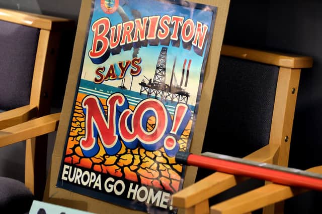 Signs at the fracking meeting at Burniston Church Hall. photo: Richard Ponter