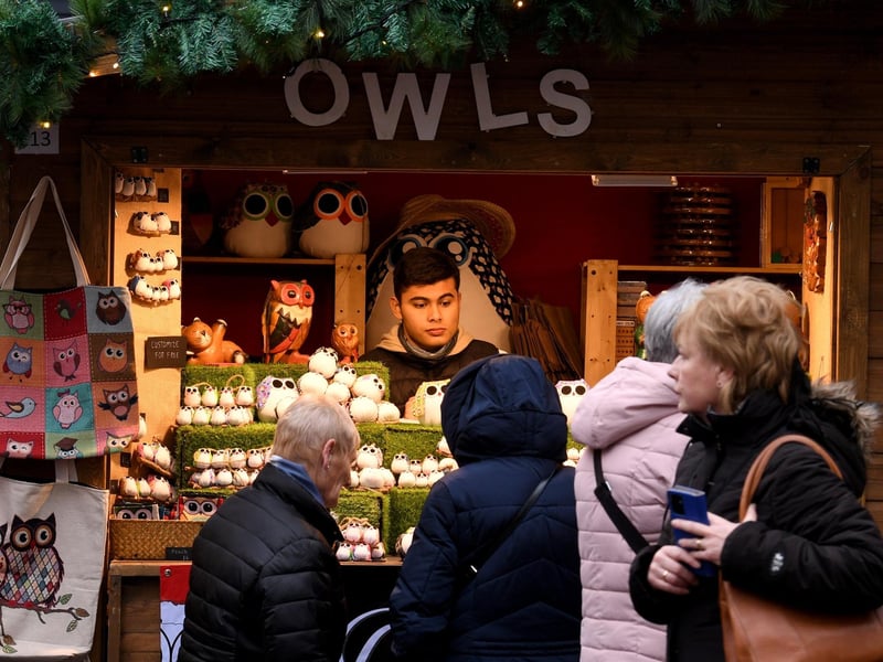 Visitors browse the Owls stall.