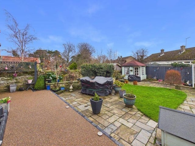 The enclosed rear garden has a terrace and a summerhouse.