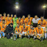 Edgehill and kit sponsor Darren Hodgson of Wonderwall Plastering line up with the North Riding FA Saturday Challenge Cup after beating Carperby 4-0.