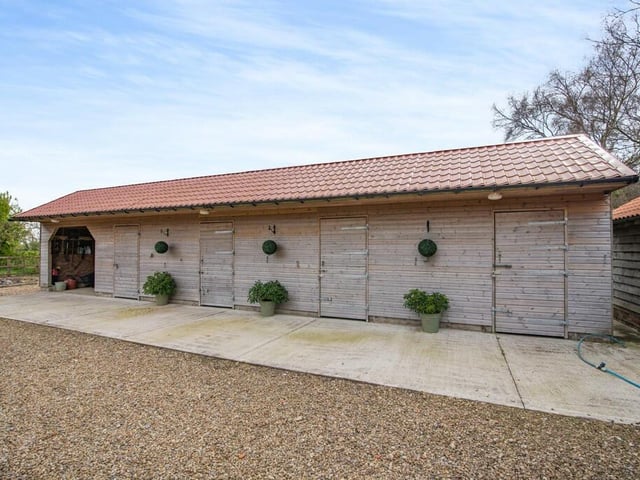 The stable block, with tack and feed rooms.