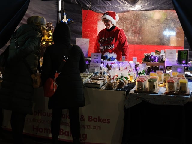 Shoppers browsing festive goods. photo: Richard Ponter