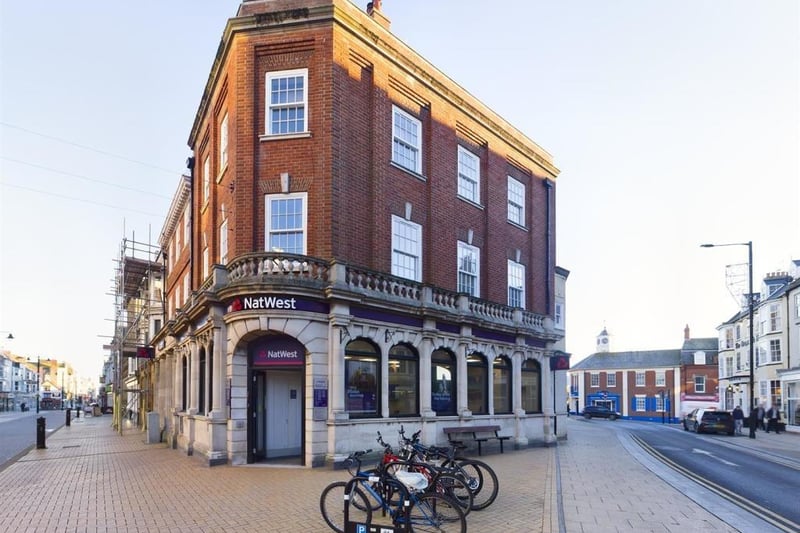 A stylish one-bed, second-floor apartment in a central town location. The building was used as a bank and was converted to apartments in 2014. This apartment has stunning original features, with many amenities on the doorstep and close to both harbour and foreshore.
Accommodation with  Upvc double glazing and gas central heating, comprises a communal entrance with door phone system, and stairs to the first floor. An inner hall has access to insulated loft space. The kitchen has fitted units, an electric oven, gas hob, and integrated fridge freezer, plus a utility room. There's a lounge with log burning stove, and three sash windows, a double bedroom, and a stylish shower room.  The apartment is leasehold, 125 years from 2014 with a £45 monthly charge which includes ground rent, and maintenance and building insurance.  Not to be used for holiday lets.