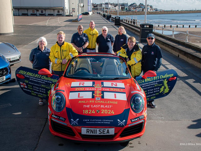 Bridlington RNLI volunteers and 'Splash' the Porsche 911.