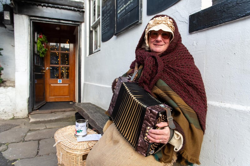 Pictured is Anna with her harmonium.