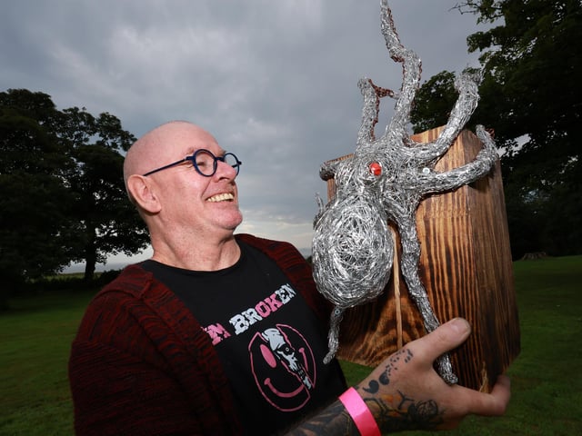 Artist Bob Tuffin with his work.