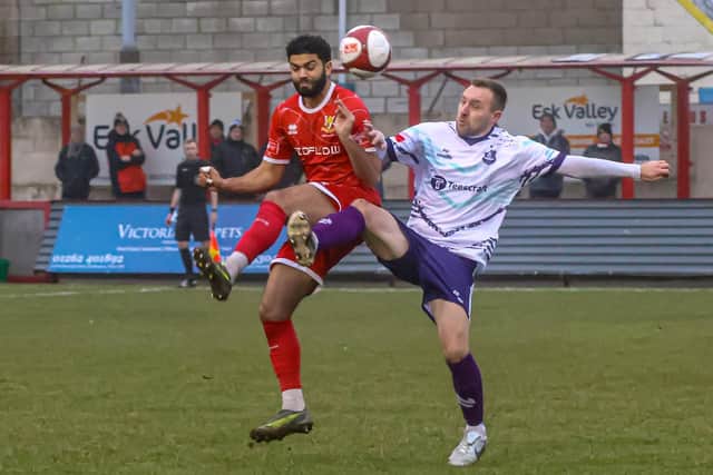 Ahmed Salam battles it out with a Bishop Auckland player. Photo by Ewan Cameron