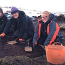 Student Maddie, 17 (far left) is joining in the DigVentures excavation.