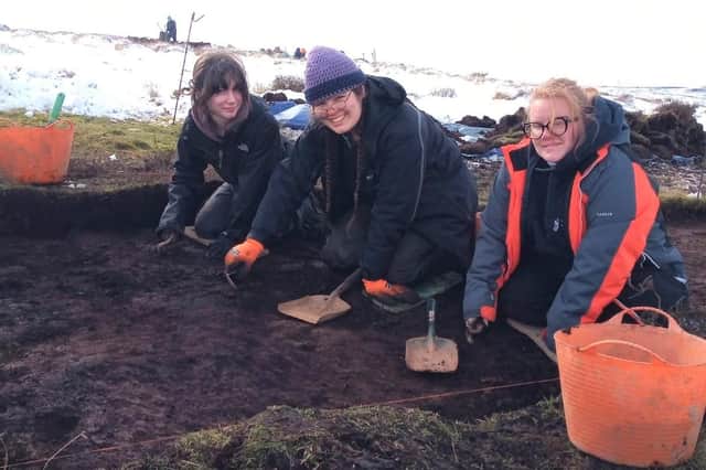 Student Maddie, 17 (far left) is joining in the DigVentures excavation.