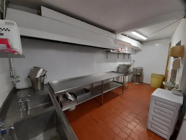 There is 'exceptional catering kitchen with separate food prep and pot-wash areas. Ample refrigeration and dry goods storerooms.