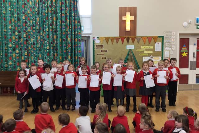 Smiles all round for their Blue Peter badges