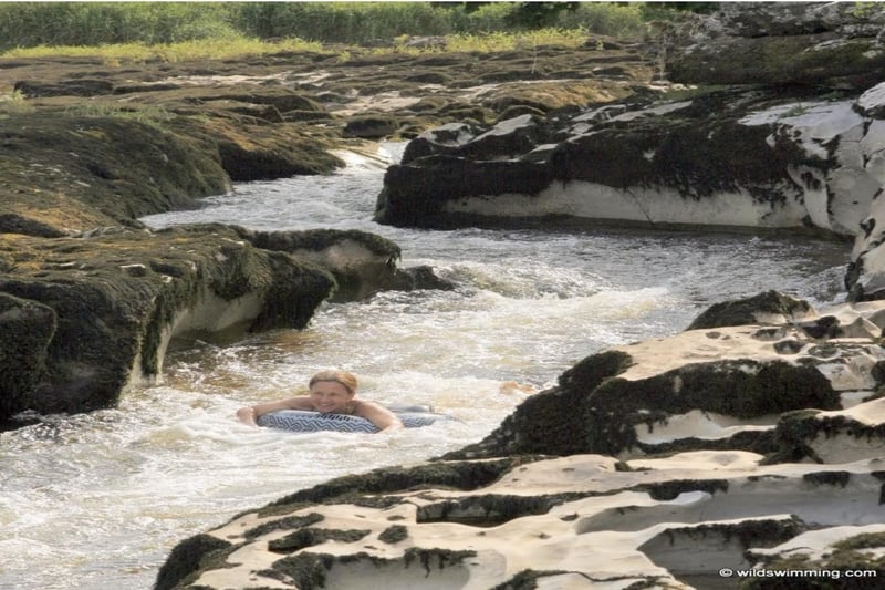 Exciting rocky pools and rapids. The lower pools can be clear enough for snorkelers including a large reach for a longer swim. 
Warmer rock pools for the less experienced. The upstream rapids have a chute so care must be taken as dangerous currents can form in high water. Do not swim after rain. The spot is located in Grassington.