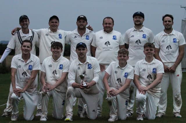 Scalby 2nds show off their Cayley Cup after the dramatic success against Cayton 2nds.