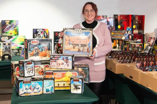 Chloe Mckenna with the Star Wars collection that started with a 1983 Christmas present.