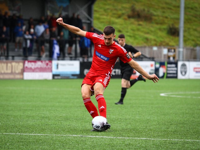 Luca Colville fires at the Tonbridge goal.